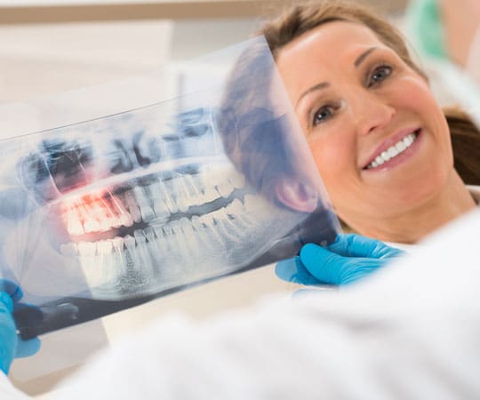 Get your front teeth repaired with a full mouth reconstruction at Bellevue Azalea Dentistry.