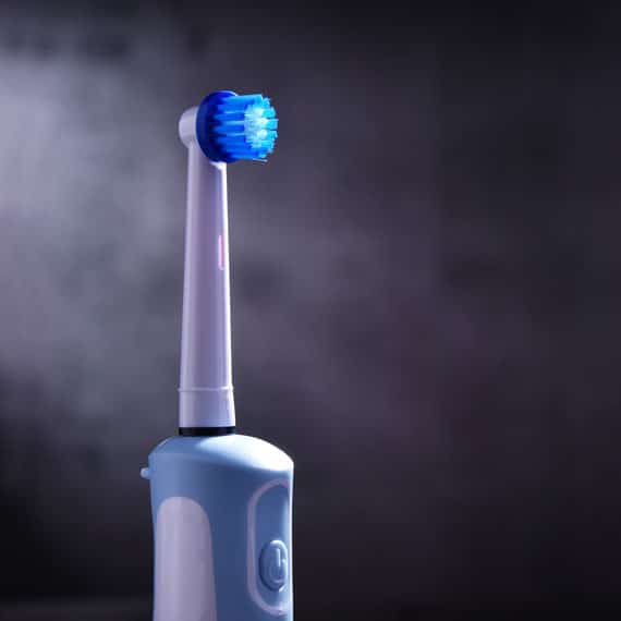 Can I Use An Electric Toothbrush With Dental Implants? - Dental Implant  Center